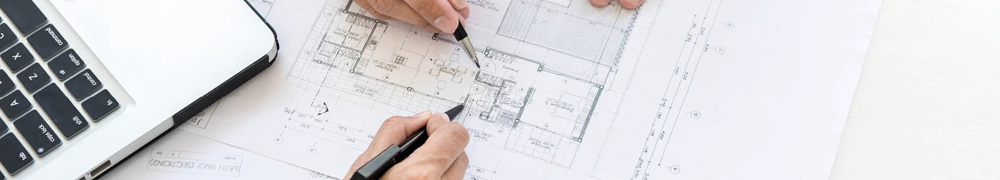 Close-up Of Person's engineer Hand Drawing Plan On Blue Print with architect equipment, Architects discussing at the table, team work and work flow construction concept.